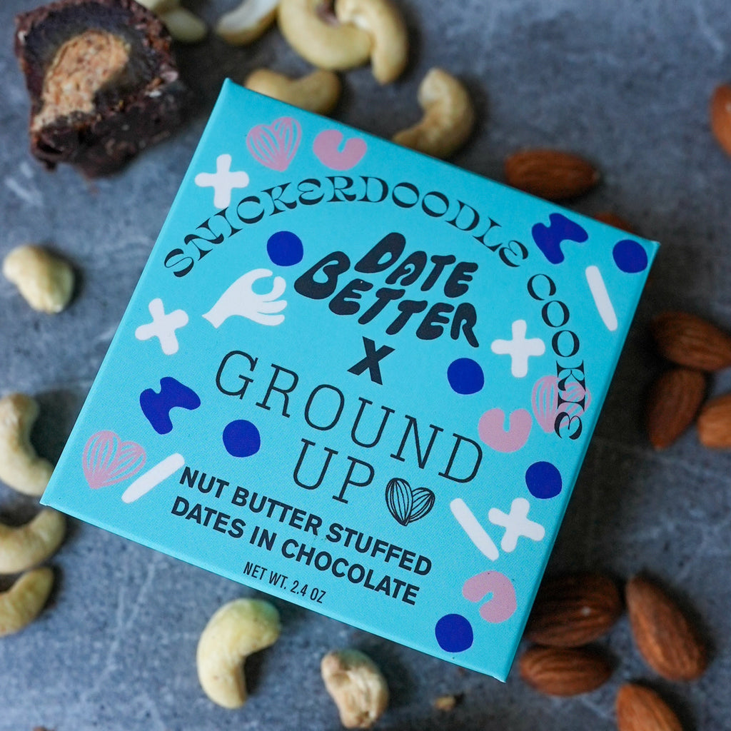 Date Better Snacks x Ground Up Collab. Pictured is the Snickerdoodle Date Bites. Dates stuffed with cinnamon snickerdoodle nut butter and coated in organic chocolate.
