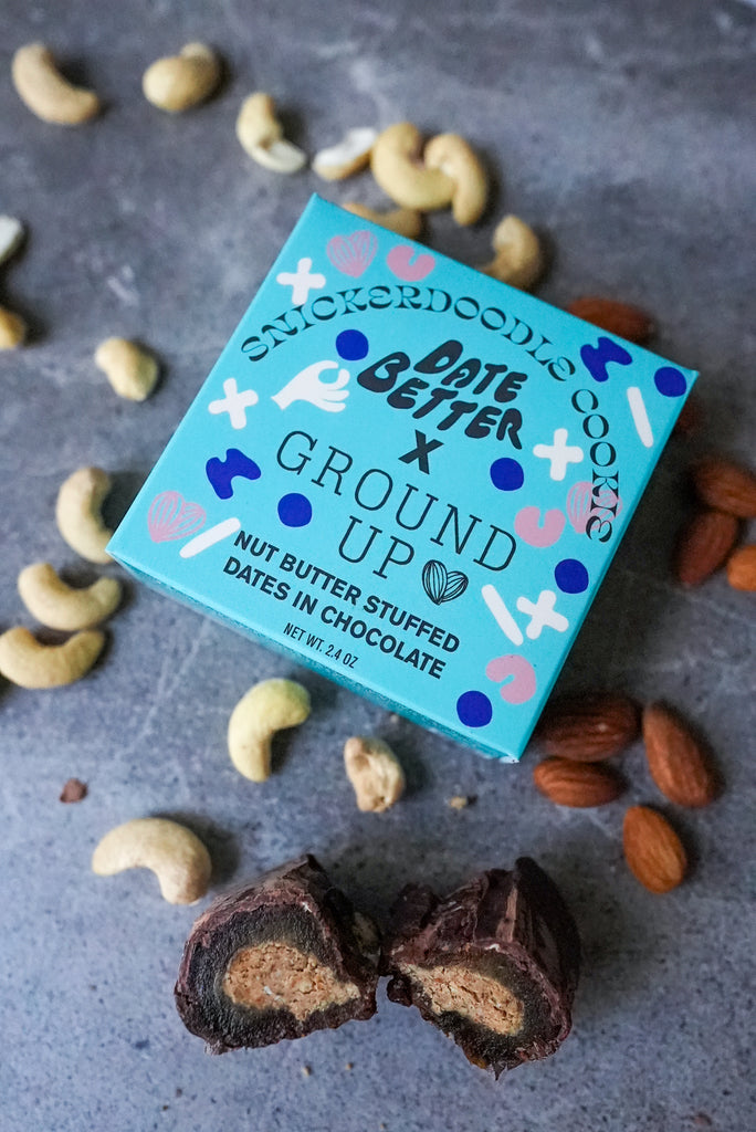 Date Better Snacks x Ground Up Collab. Pictured is the Snickerdoodle Date Bites. Dates stuffed with cinnamon snickerdoodle nut butter and coated in organic chocolate.
